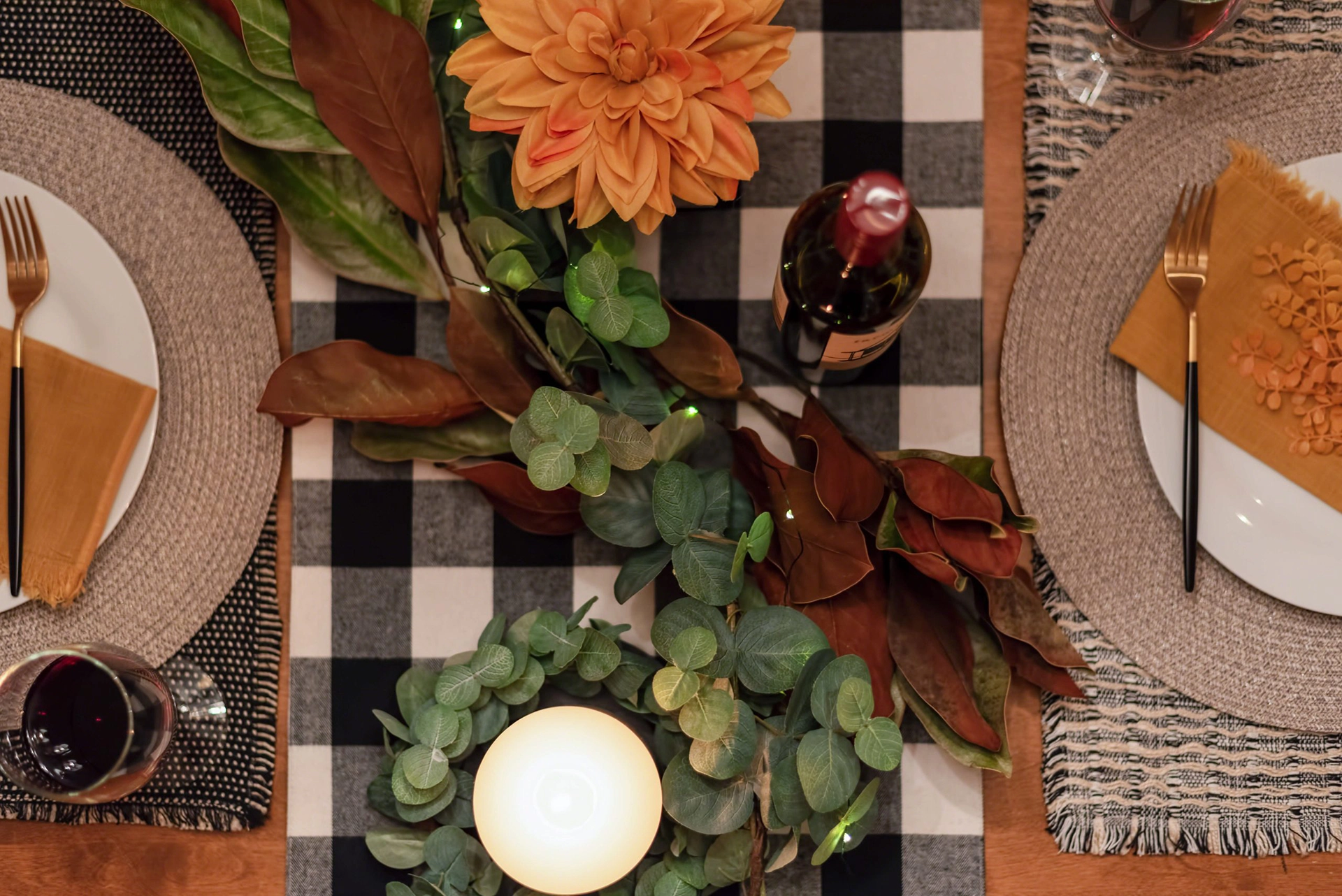 A table set with a black and white checkered tablecloth, creating a classic and elegant ambiance.